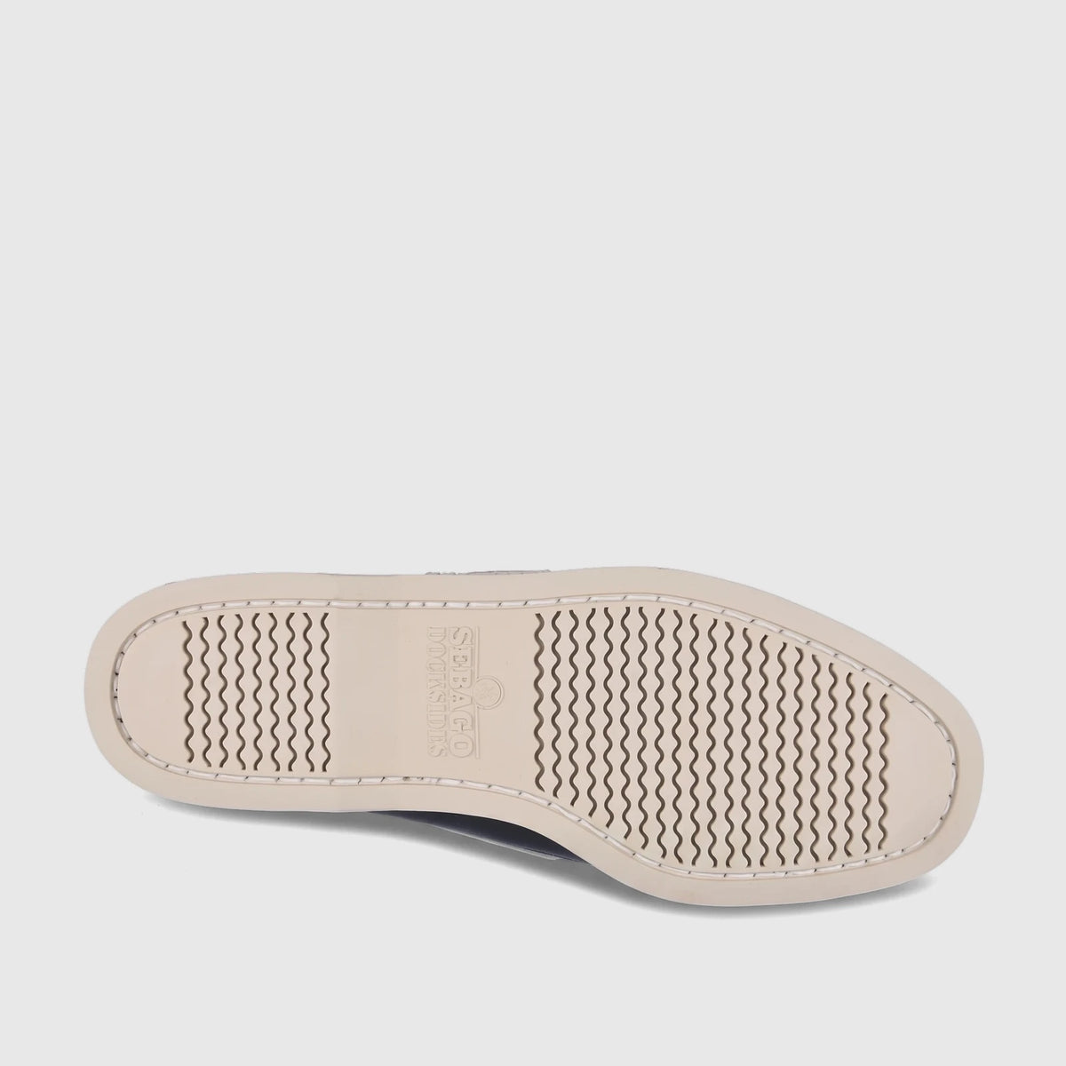 Cream-colored rubber sole of a Sebago Men's Portland Spinnaker Nubuck shoe, overhead view. Shows wavy tread pattern and