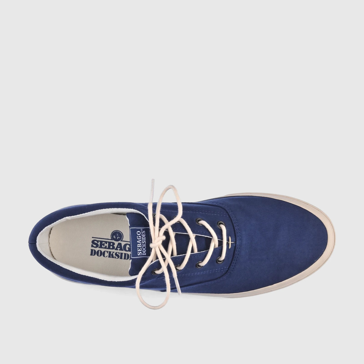 Men's Sebago Sneaker in blue navy canvas with cream laces, shown from a top-down view on a white background.