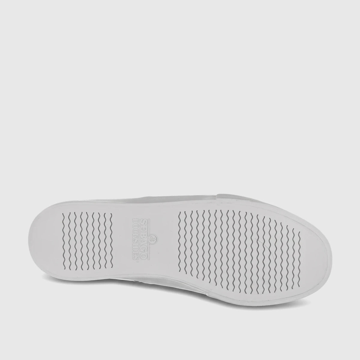 White Sebago Men's sneaker sole with wavy traction pattern and Docksides logo, shown from a top-down view.