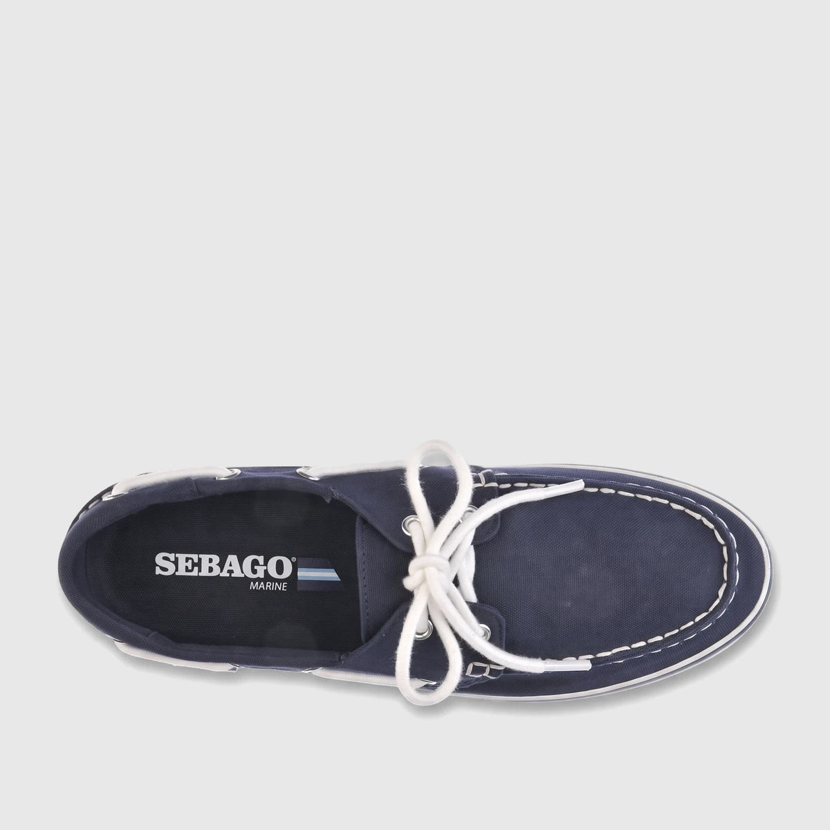 Sebago Unisex Boat Shoe Pascal in navy blue canvas, featuring white laces and contrast stitching, photographed from a