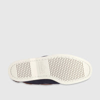 Sole of a Sebago Women's Portland Archive A53 boat shoe in navy blue and brown with a tan sole, shown from a top-down