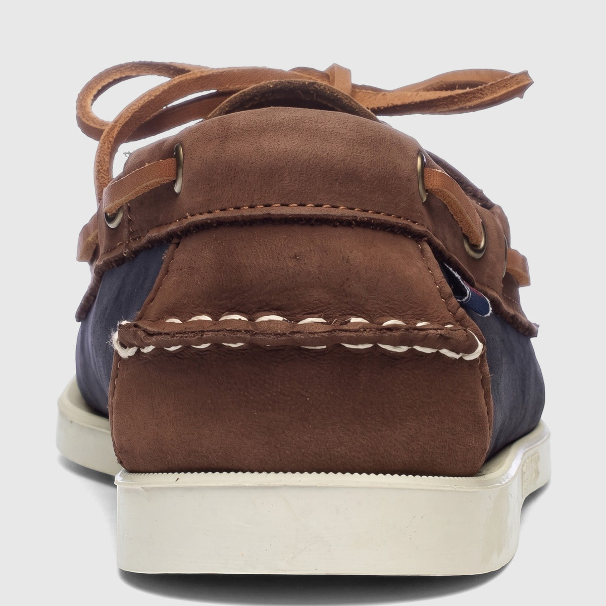 Rear view of a single Sebago Women Portland Archive A53 boat shoe in navy blue and brown leather with white stitching and