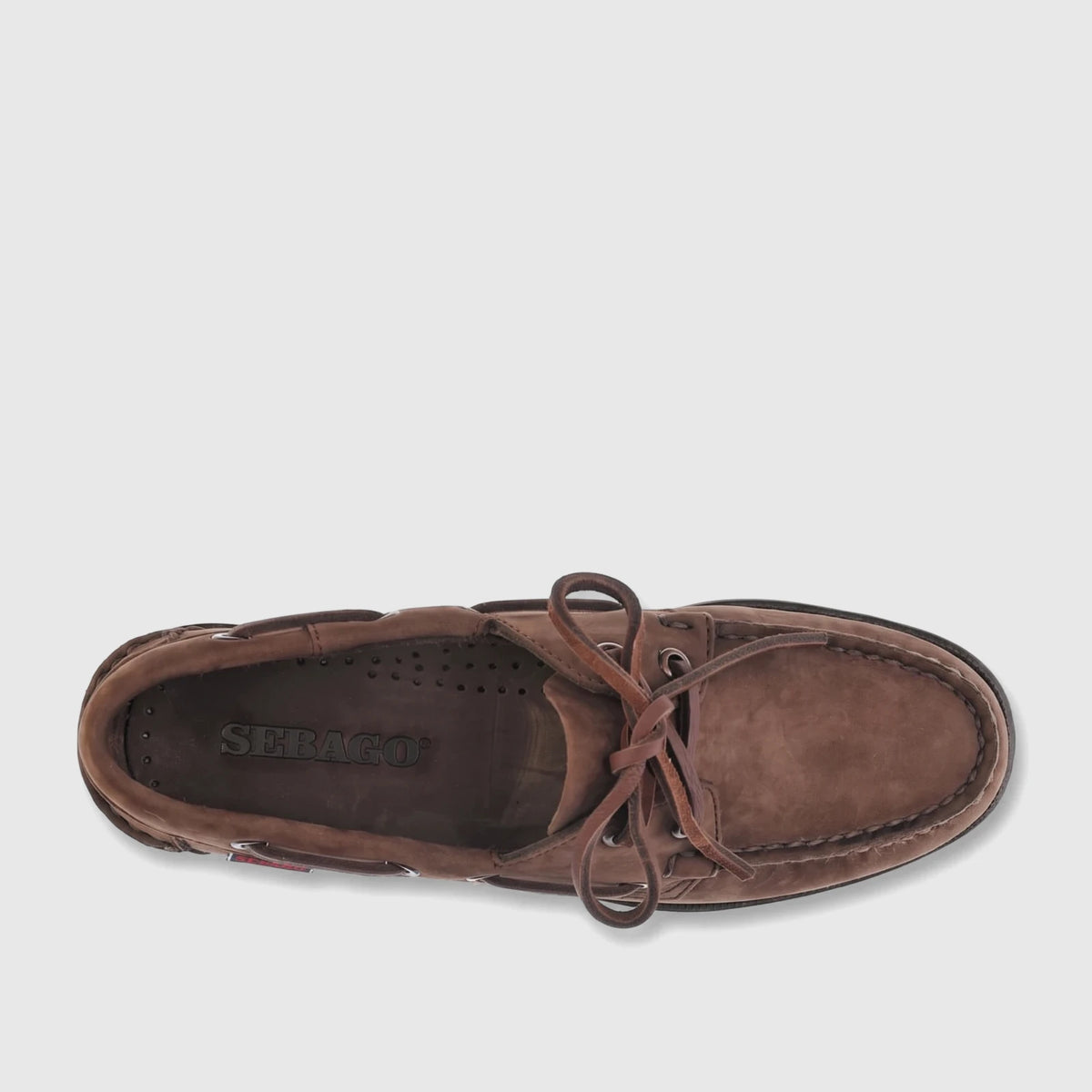 Top-down view of a single Sebago Women's Portland nubuck boat shoe in total beige taupe with leather laces.