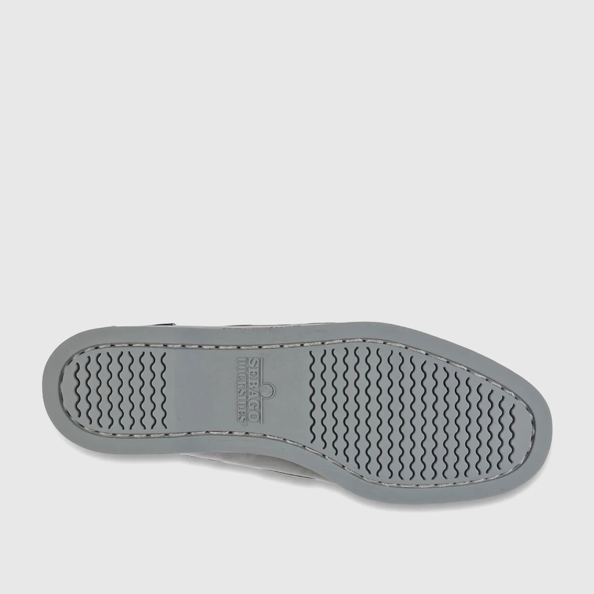 Bottom view of a single Sebago Women Portland Nubuck shoe in total mid grey, showcasing its distinctive wavy patterned sole.