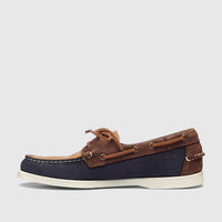 Sebago Women's Portland Archive A53 boat shoe in navy, brown, and tan leather with a white sole, viewed from the side.