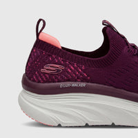 Skechers D'Lux Walker women's comfort slip-on sneakers in plum with a knit upper and chunky white sole, side view.