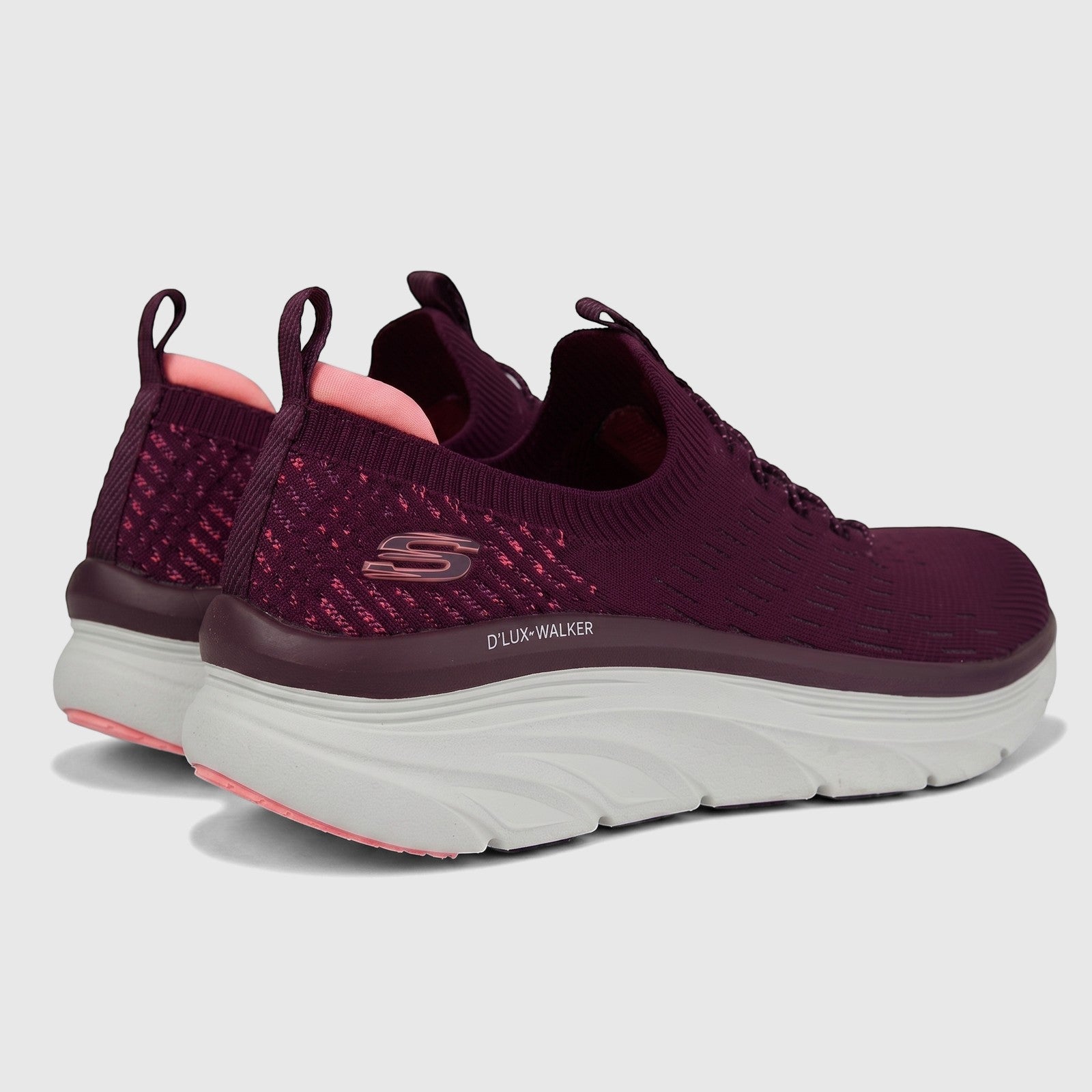 Skechers Ladies D'Lux Walker slip-on sneakers in plum knit fabric, shown from a rear angle with white soles.