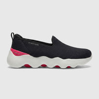 Skechers Ladies Comfort Slip On Sneaker Go Walk Massage Fit in black with a white wavy midsole and hot pink accents, side