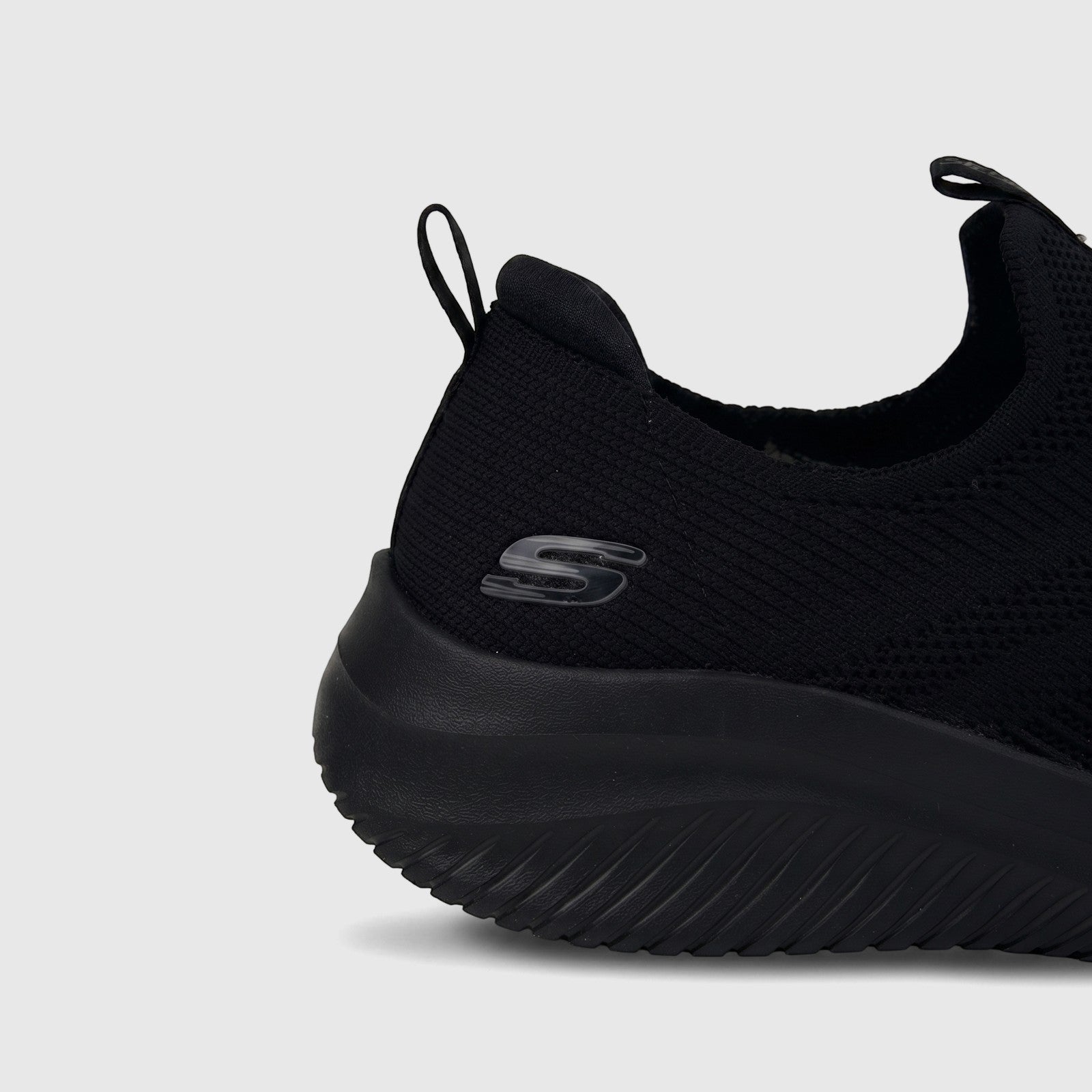 Close-up side view of a black Skechers Ladies Comfort Slip On Sneaker Ultra Flex 3.0, showing the knit upper and Skechers