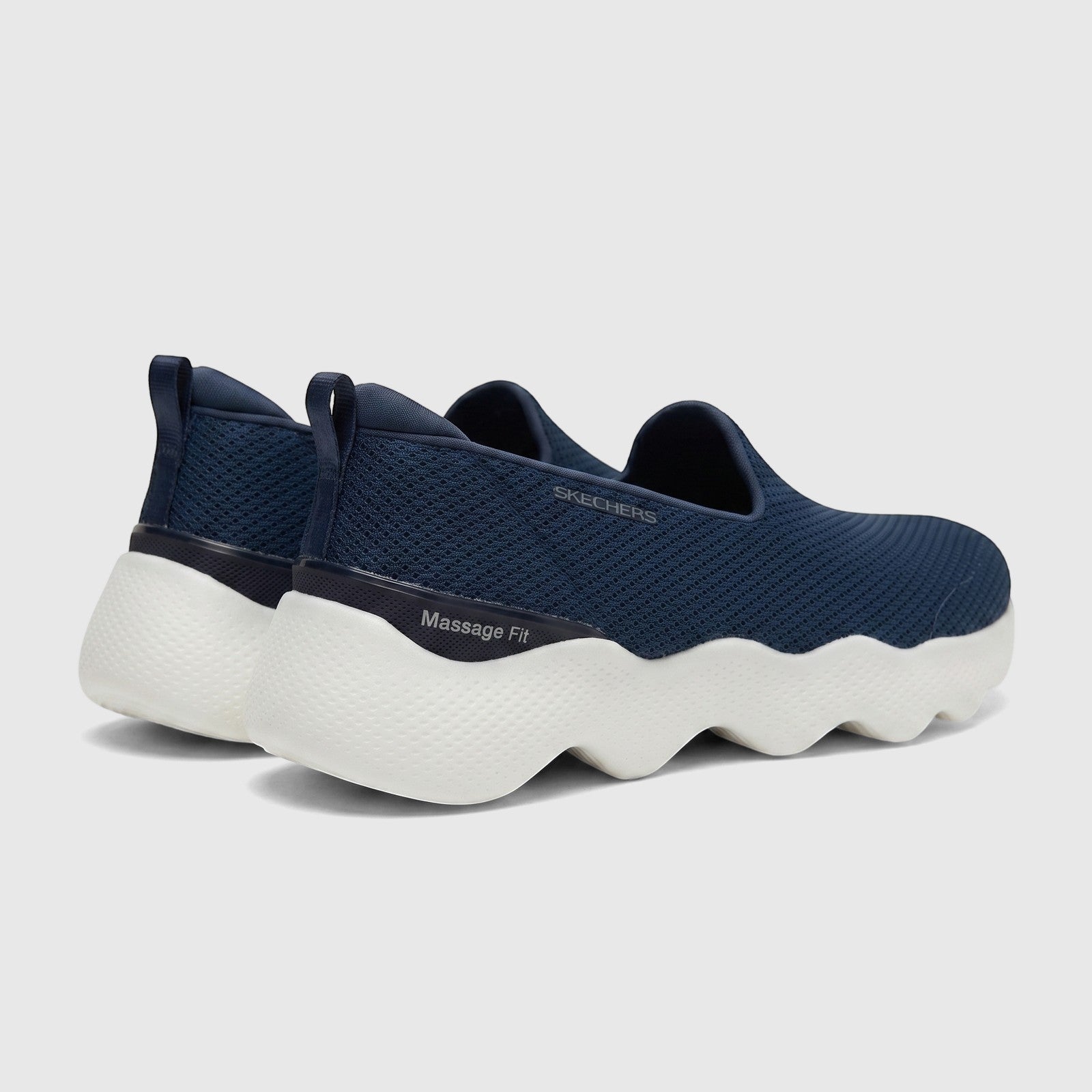 Rear view of Skechers Ladies Comfort Slip On Sneaker Go Walk Massage Fit 124908 in navy, featuring a textured white sole.