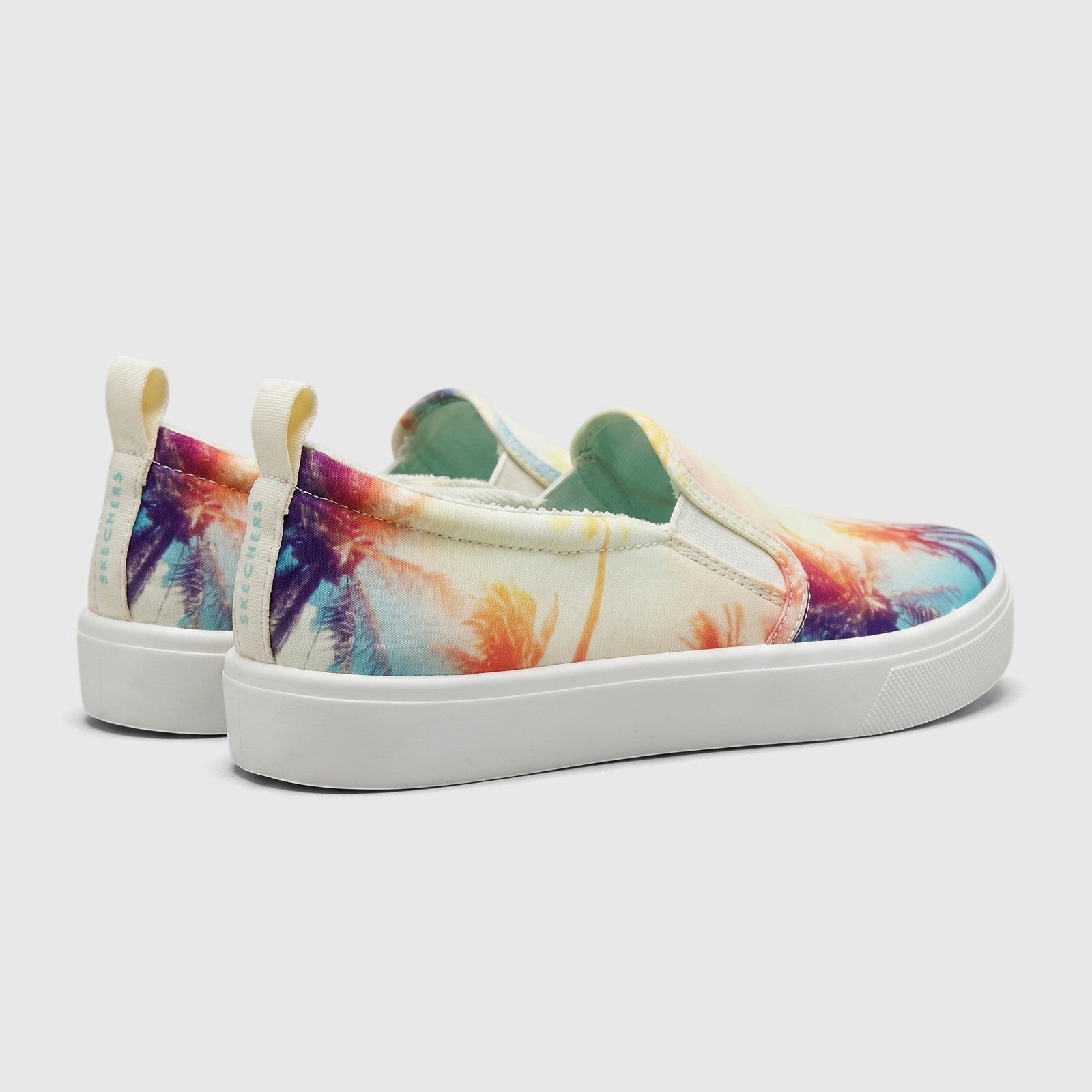 Pair of Skechers Ladies Comfort Slip On Sneakers, Poppy 177996 Multi SW143, featuring a vibrant palm tree print canvas upper