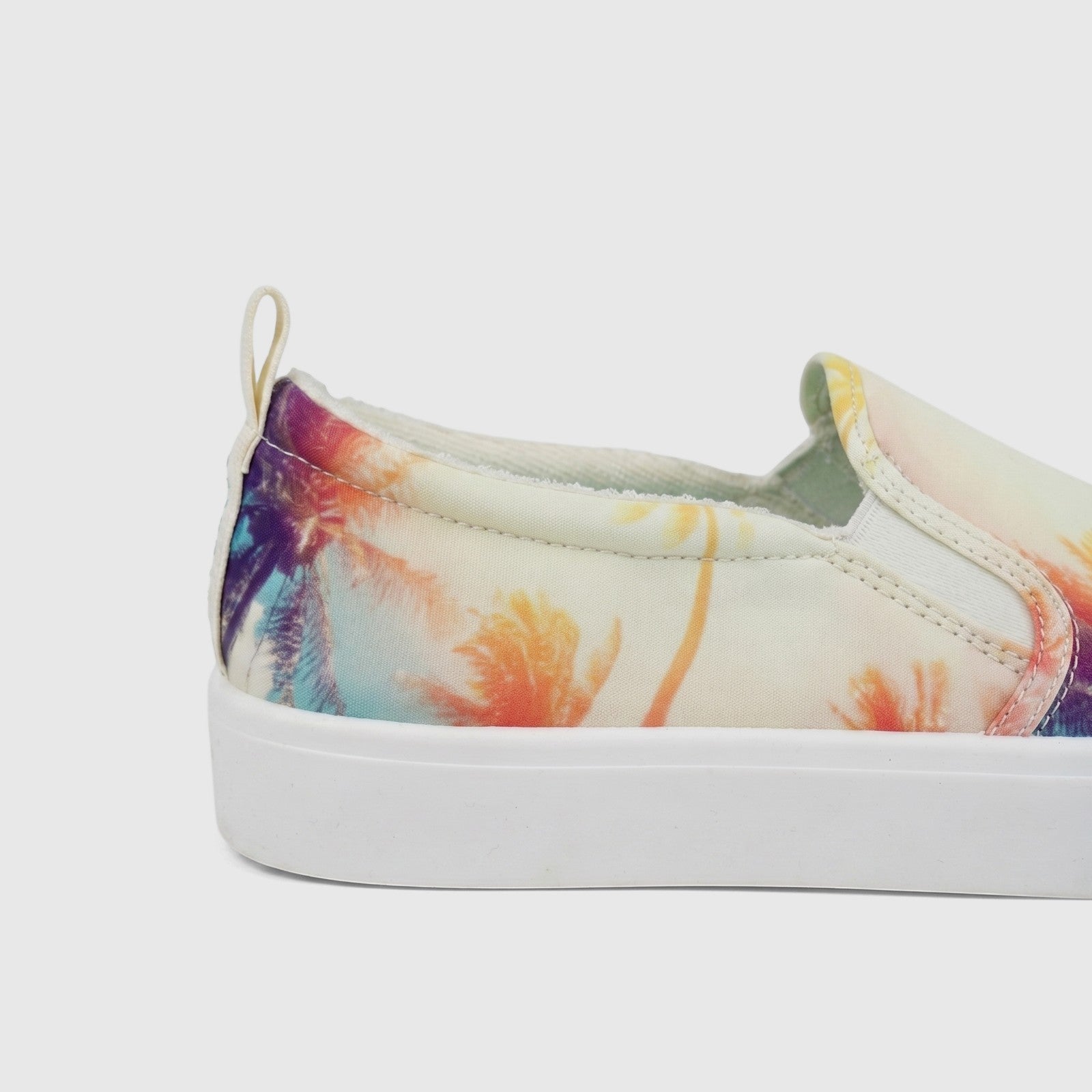 Skechers Ladies Comfort Slip On Sneaker Poppy 177996 with a vibrant multi-colored palm tree print, shown from the side.