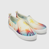 Skechers Ladies Comfort Slip On Sneakers, Poppy 177996, with a vibrant multi-color palm tree print and white soles.