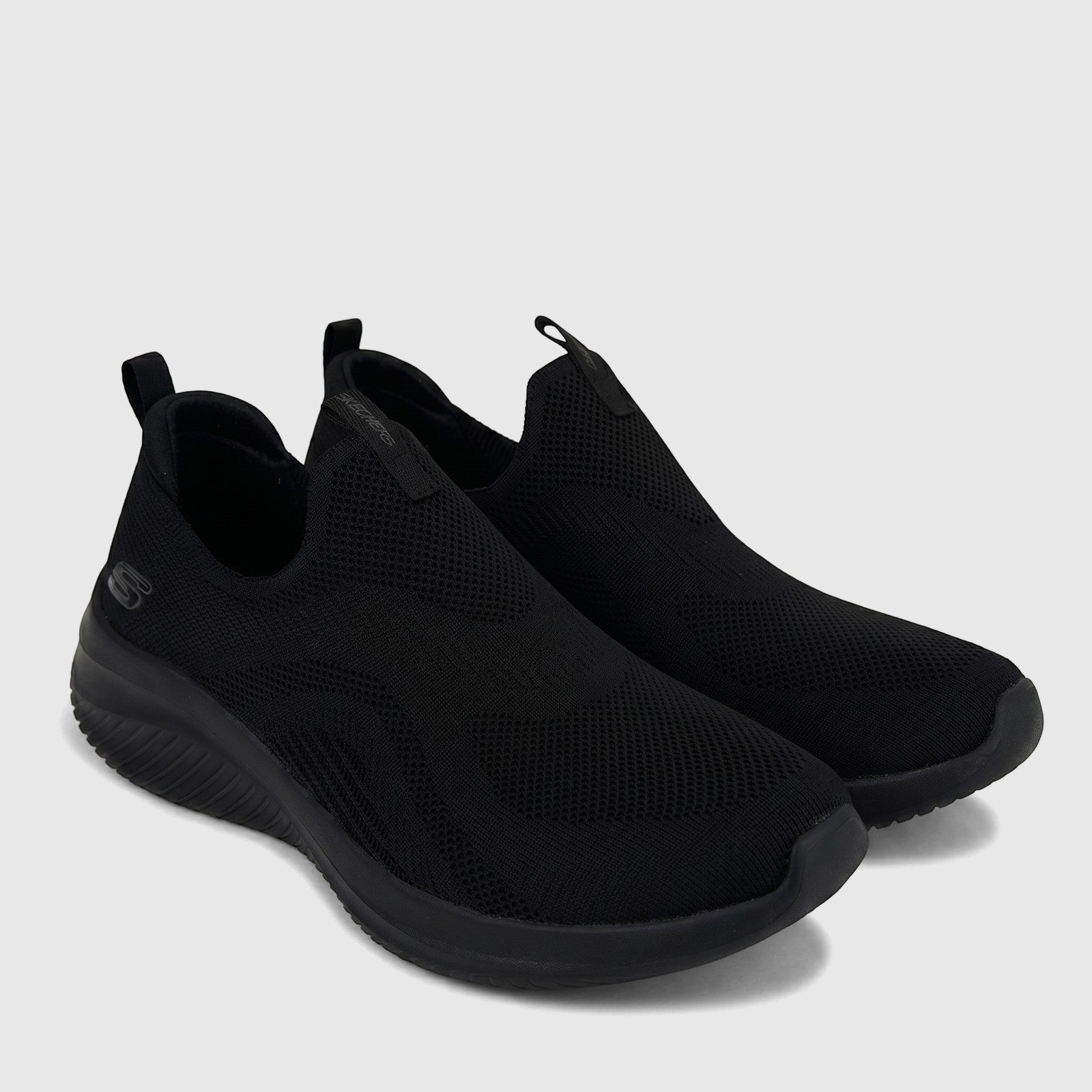 Black Skechers Ladies Comfort Slip On Sneakers, Ultra Flex 3.0 model, featuring a breathable knit upper and cushioned sole,