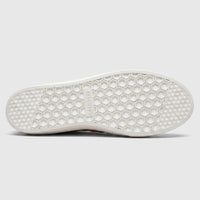 White Skechers Ladies Comfort Slip On Sneaker, bottom view showing the hexagonal tread pattern and logo.
