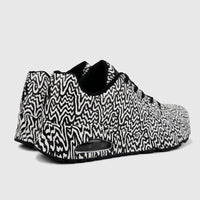 Skechers Ladies Sneaker Comfort Sneaker Uno 177960 sneakers in black and white wavy pattern, showing side-rear view.