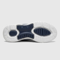 Underside view of Skechers Ladies Slip Ins Comfort Sneaker Go Walk Arch Fit in navy and white, highlighting the sole.