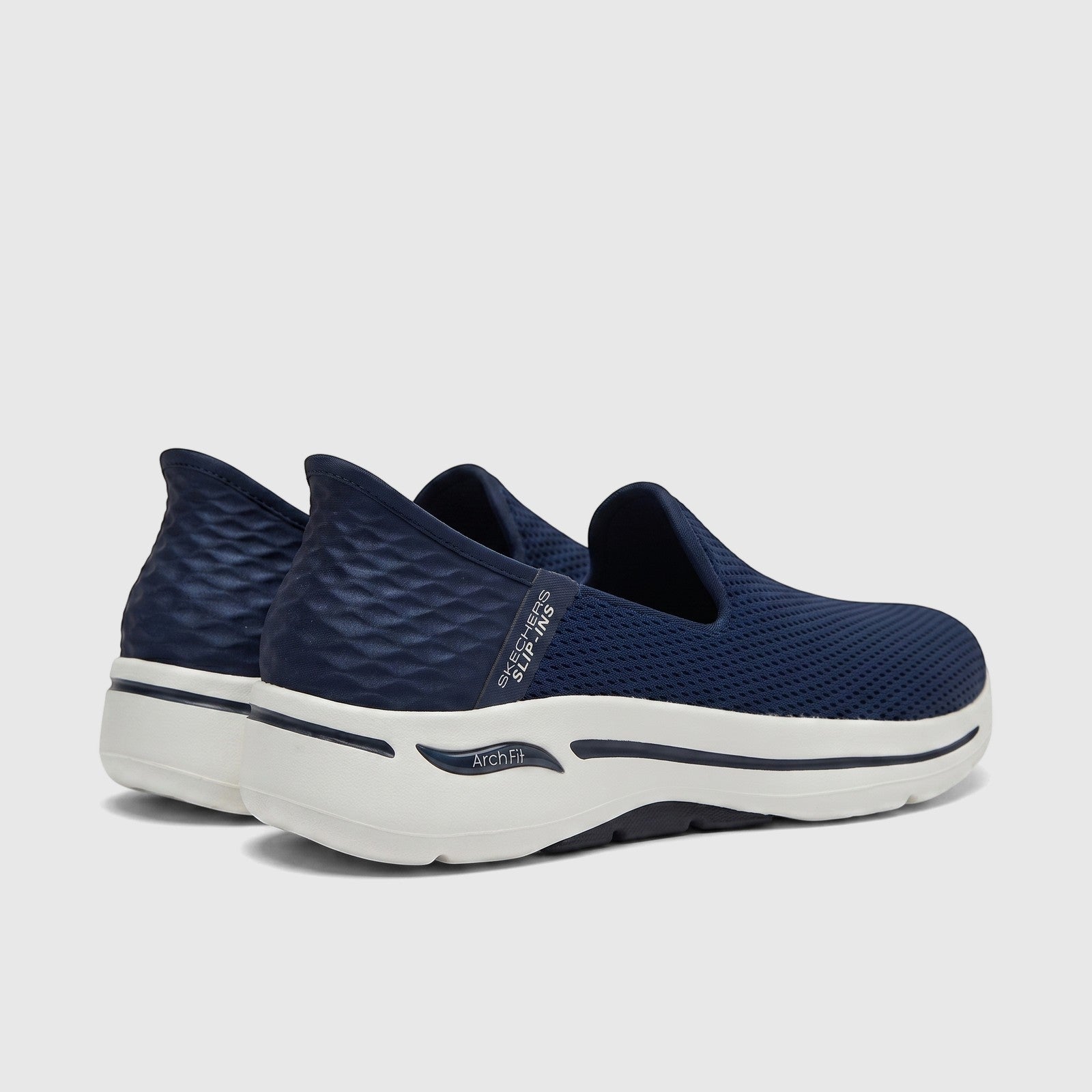 Skechers Ladies Slip Ins Comfort Sneaker Go Walk Arch Fit in navy blue and white, featuring a mesh upper and slip-on design.