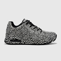 Skechers Ladies Uno 177960 comfort sneaker in black and white with an abstract swirly pattern, side profile view.