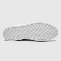 White Skechers Men's Comfort Sneaker Arch Fit Legend, bottom view, featuring the sole with a herringbone pattern and