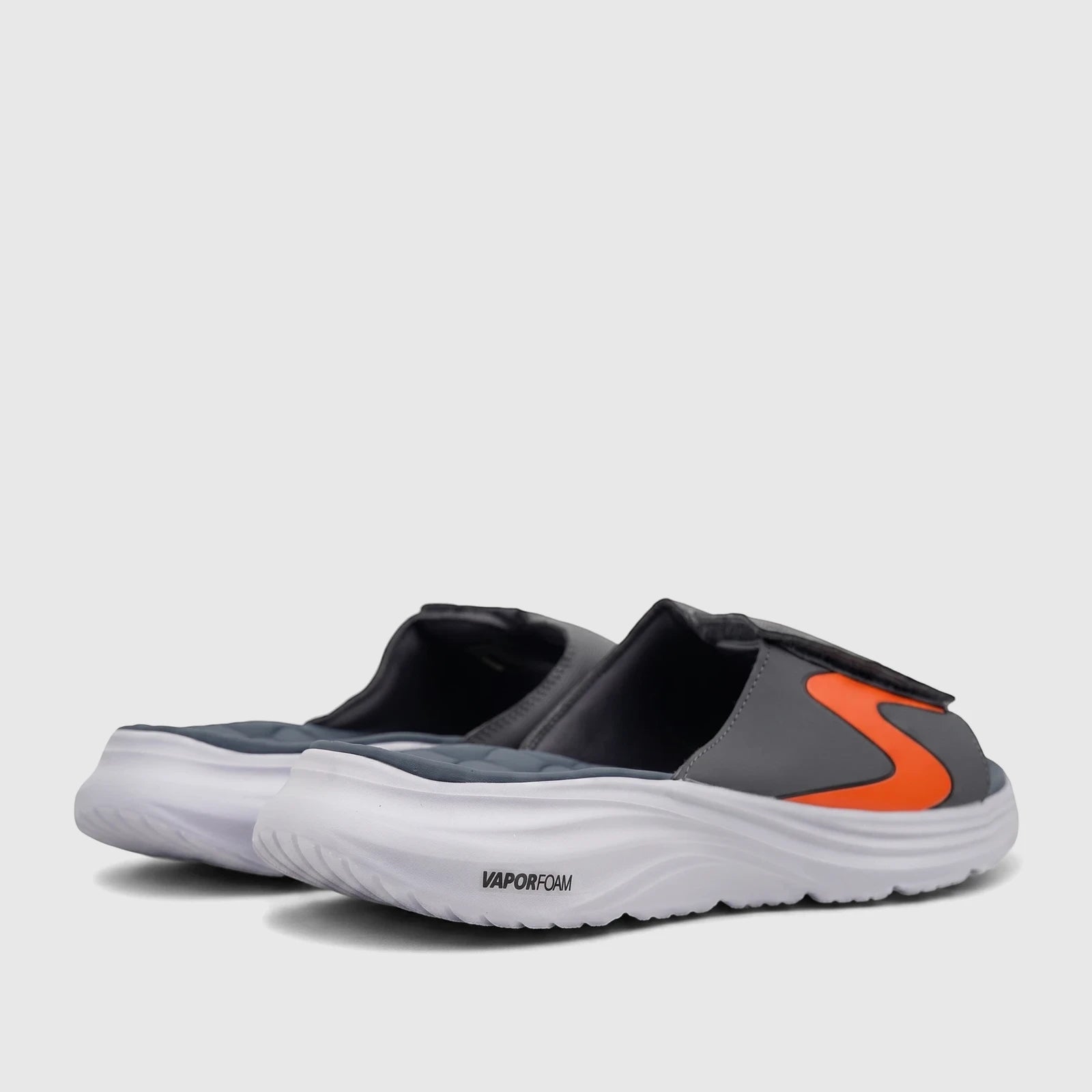 A pair of Skechers Men's Comfort Vapor Foam Sandals in grey and orange, featuring a thick white sole with 'VAPORFOAM'