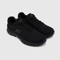 A pair of black Skechers Men's Go Walk 7 comfort sneakers with mesh uppers, shown angled on a white surface.