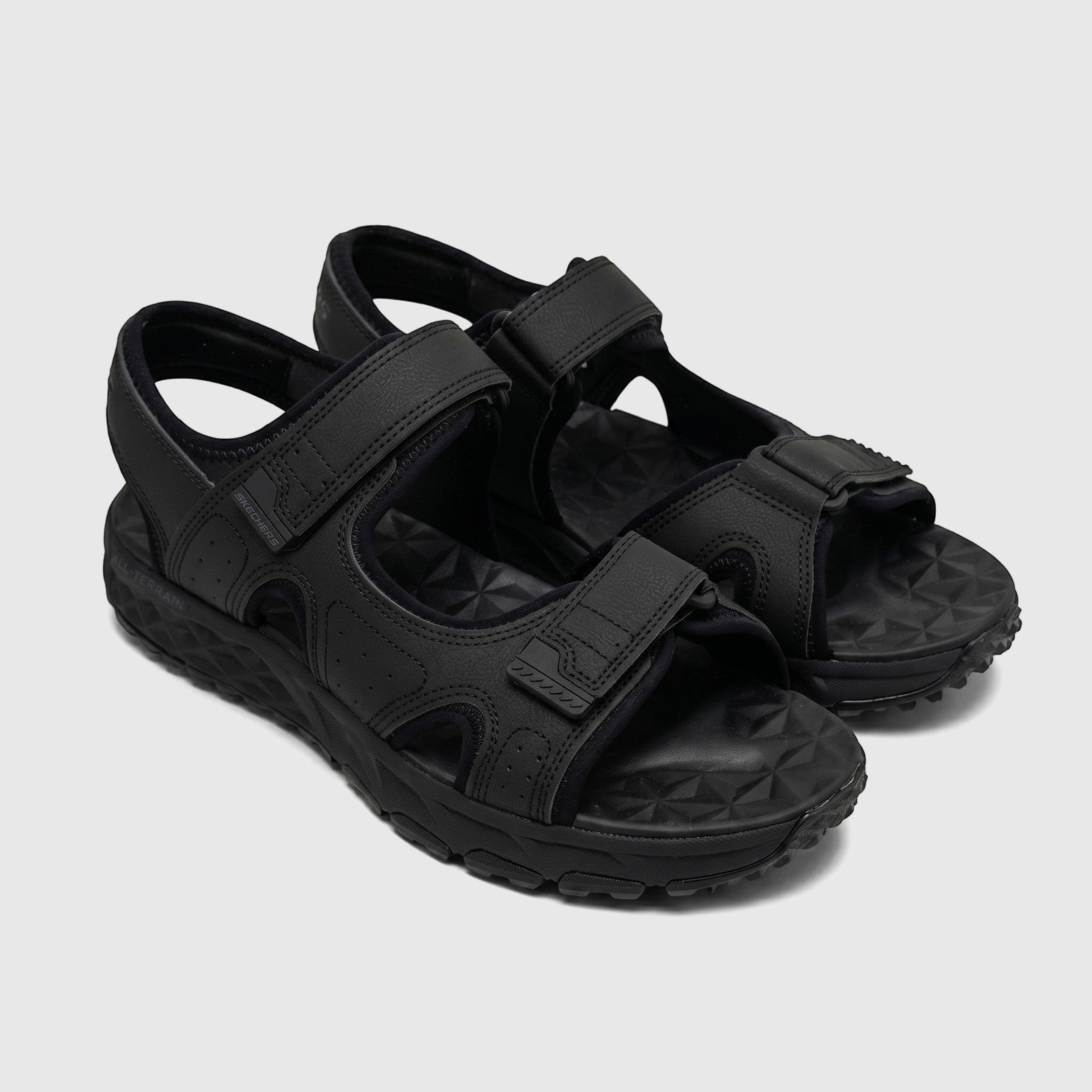 Skechers Men's Adventure Sandal Escape Plain Trail 237588, black with adjustable straps, presented from an angled view.