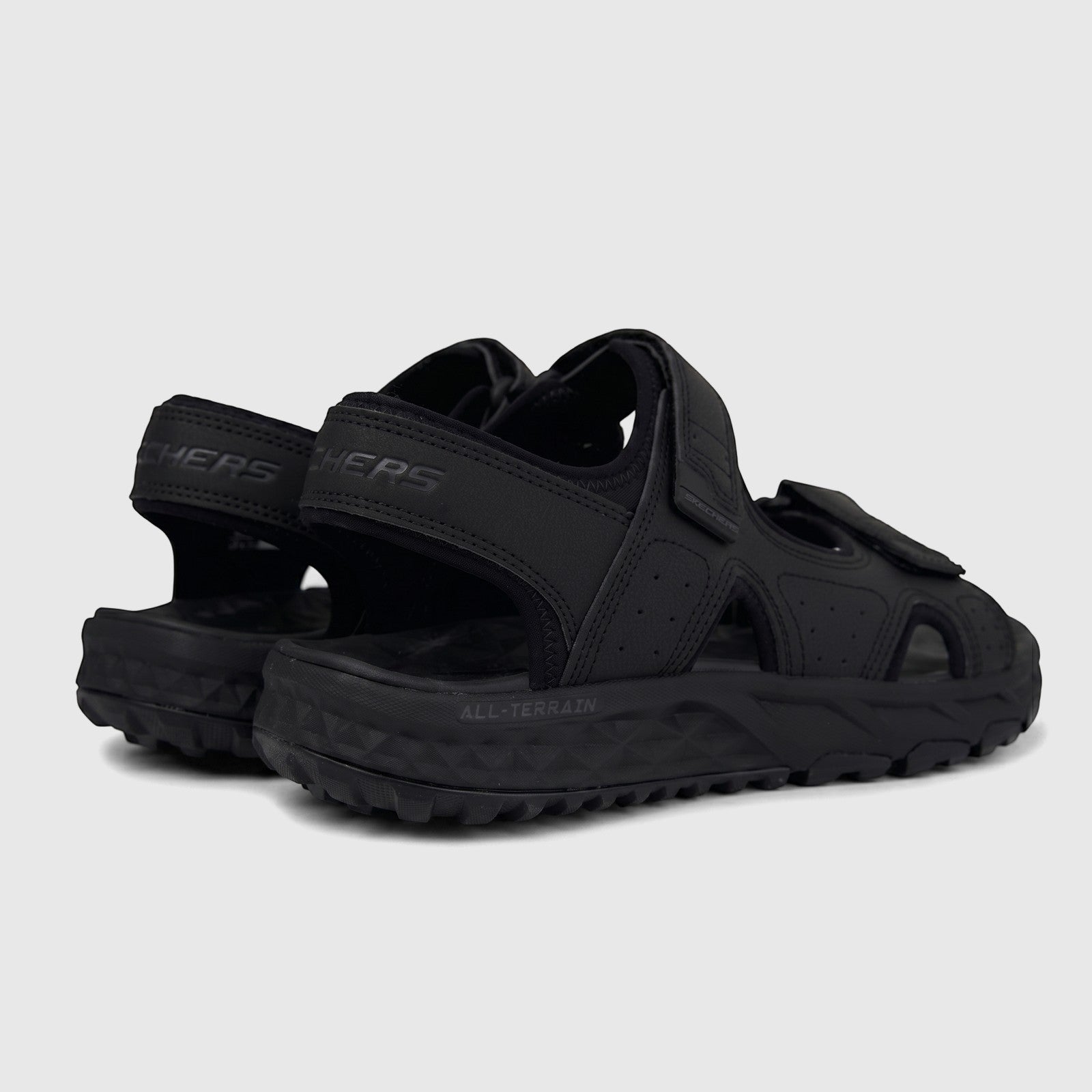 Black Skechers Men's Adventure Sandal Escape Plain Trail 237588. Rear-side view highlighting the rugged sole and durable