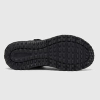 Bottom view of a black Skechers Men's Adventure Sandal Escape Plain Trail shoe sole with a textured tread pattern.