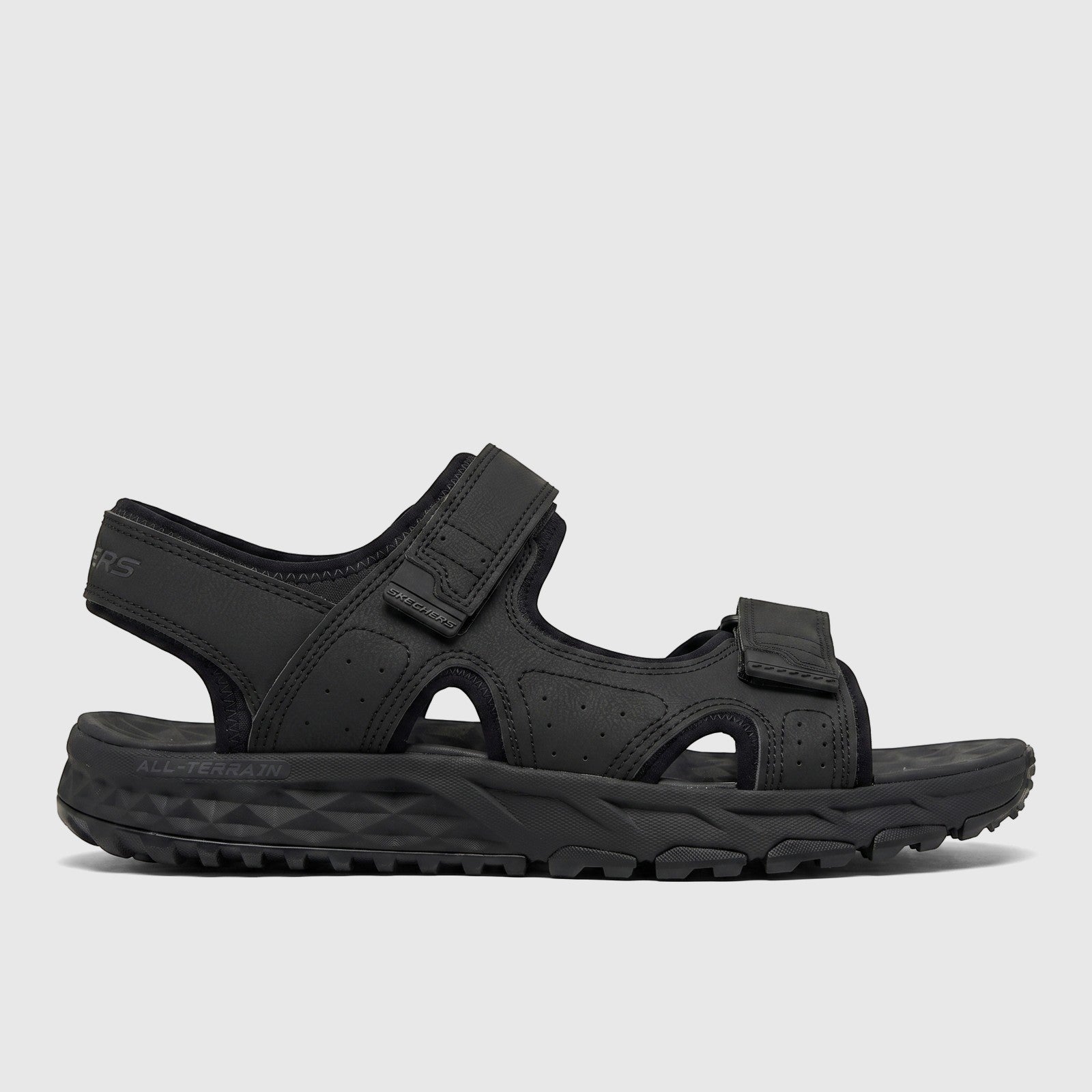 Black Skechers Men's Adventure Trail Sandal with adjustable hook-and-loop straps and a rugged all-terrain sole.