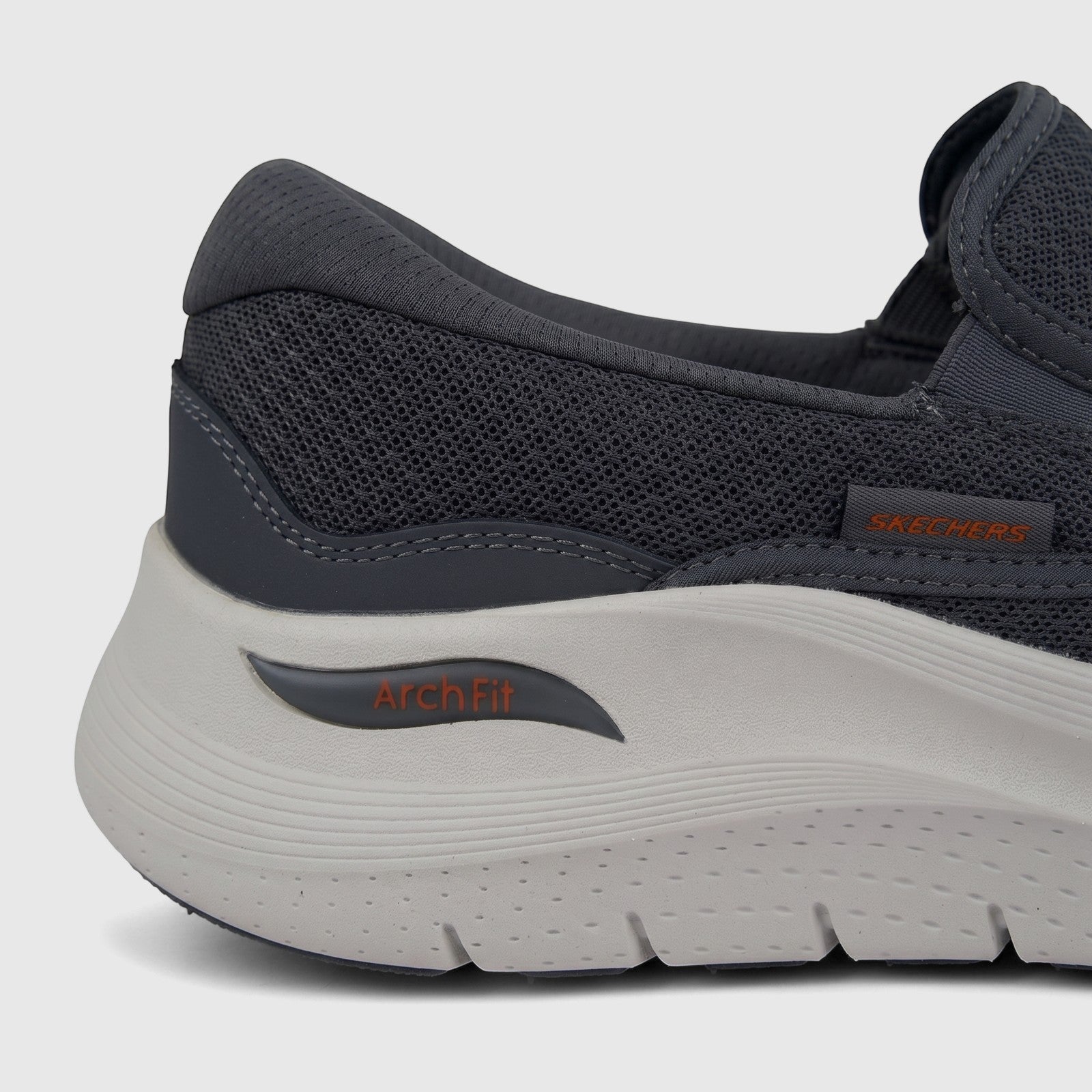 Close-up side view of a men's dark grey Skechers Arch Fit 2.0 slip-on sneaker with mesh upper and white sole.