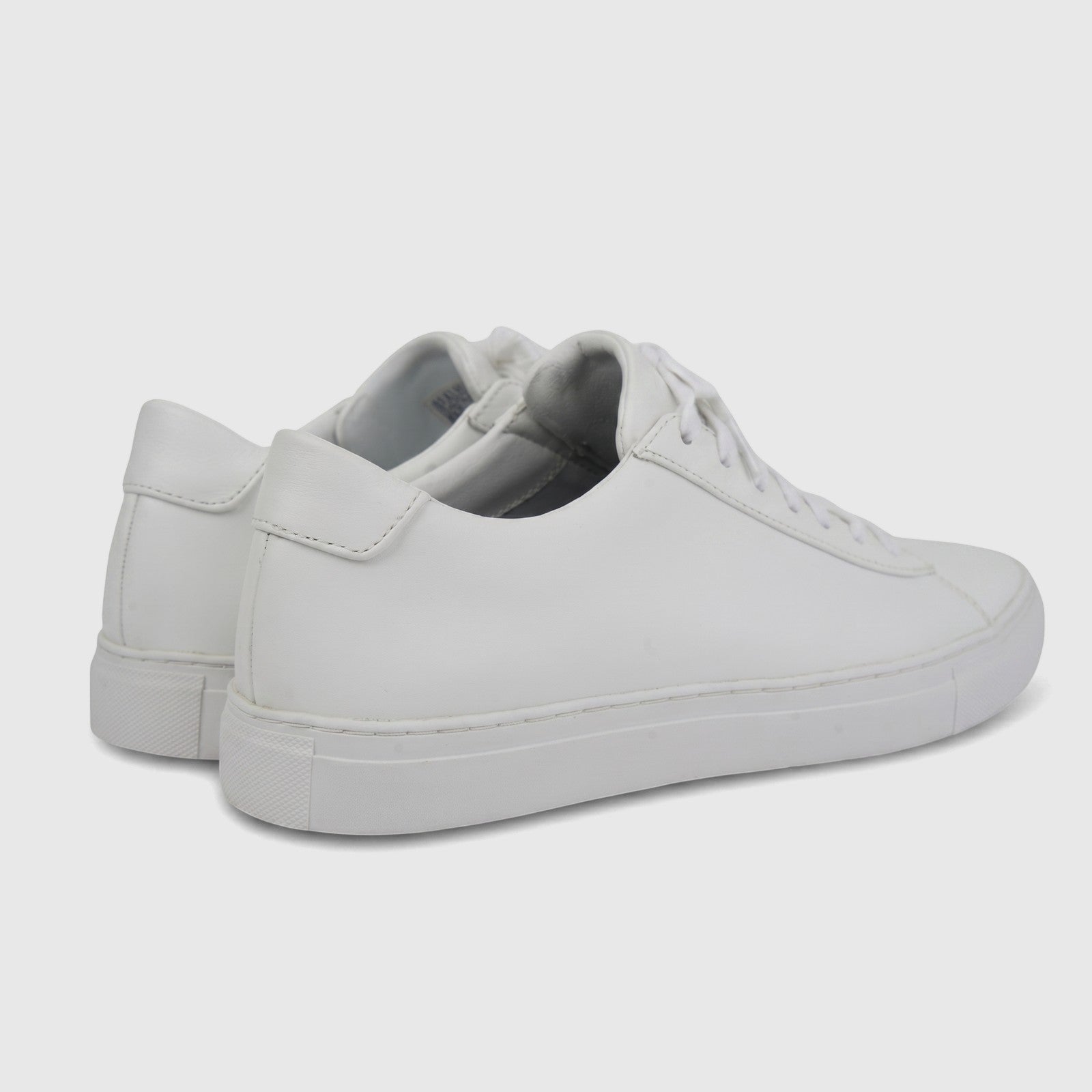 White Skechers Men's Arch Fit Legend comfort sneakers, showing the rear and side profile on a clean background.