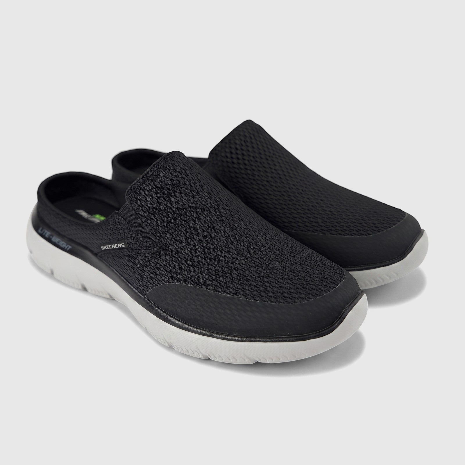 A pair of black Skechers Men's Comfort Open Back Slip On Summits Vindicator shoes with mesh upper and light grey soles.