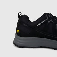 Black Skechers Men's Comfort/Safety Sneaker Workmalad II, featuring a grey sole and yellow ESD safety symbol on the heel.