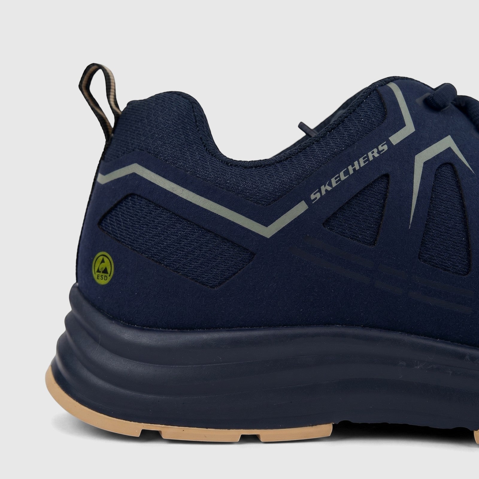 Close-up of a men's Skechers Comfort/Safety Sneaker Workmalad II Composite Toe in navy blue and tan, featuring an ESD safety