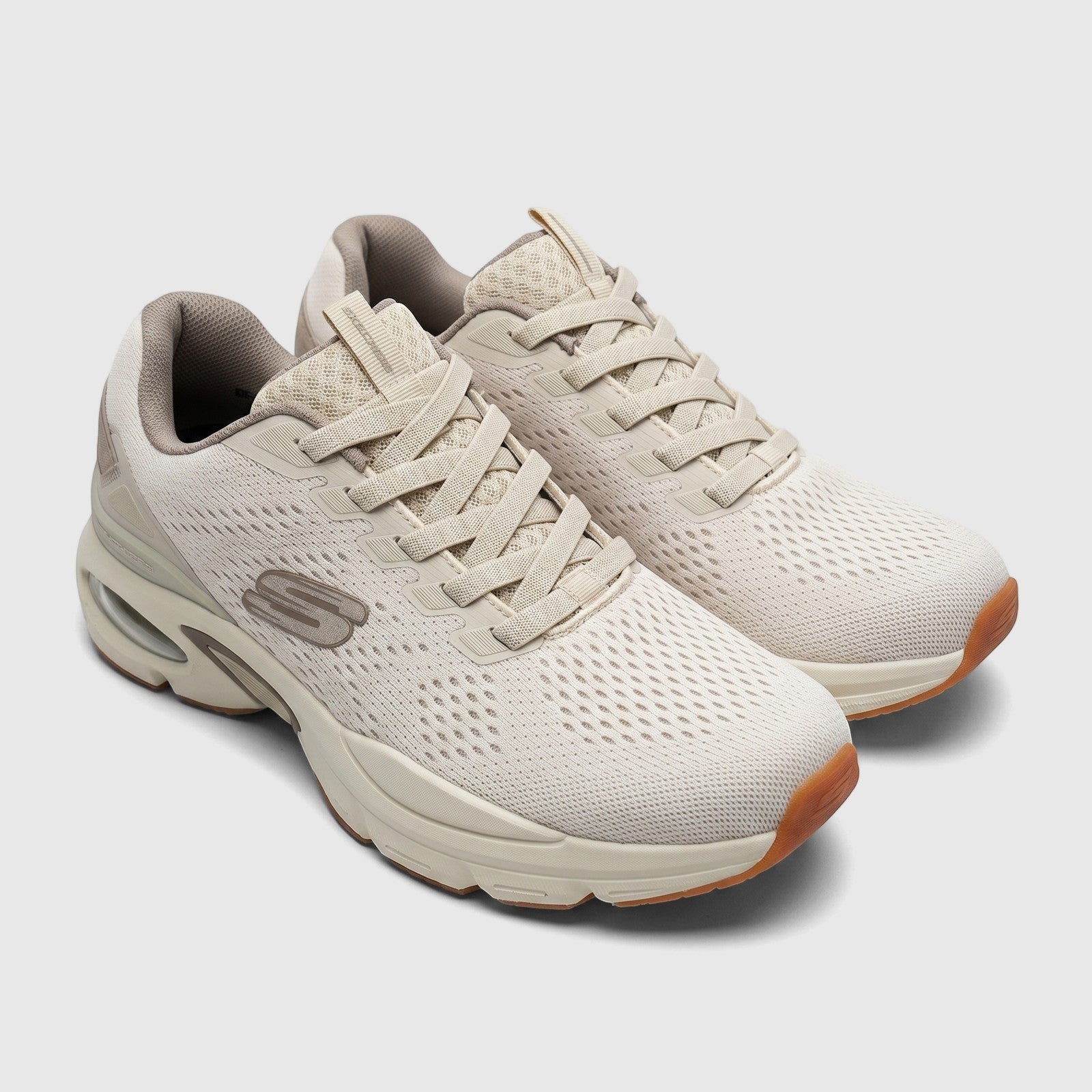 Skechers Men's Comfort Skech-Air Ventura sneakers in off-white mesh with a visible air cushion sole and brown accents.
