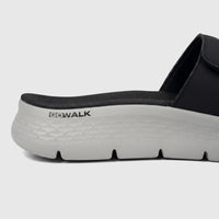 Skechers Men's Comfort Slide Go Walk Flex Sandal in black and gray, side view showing the sole and GOWALK logo.