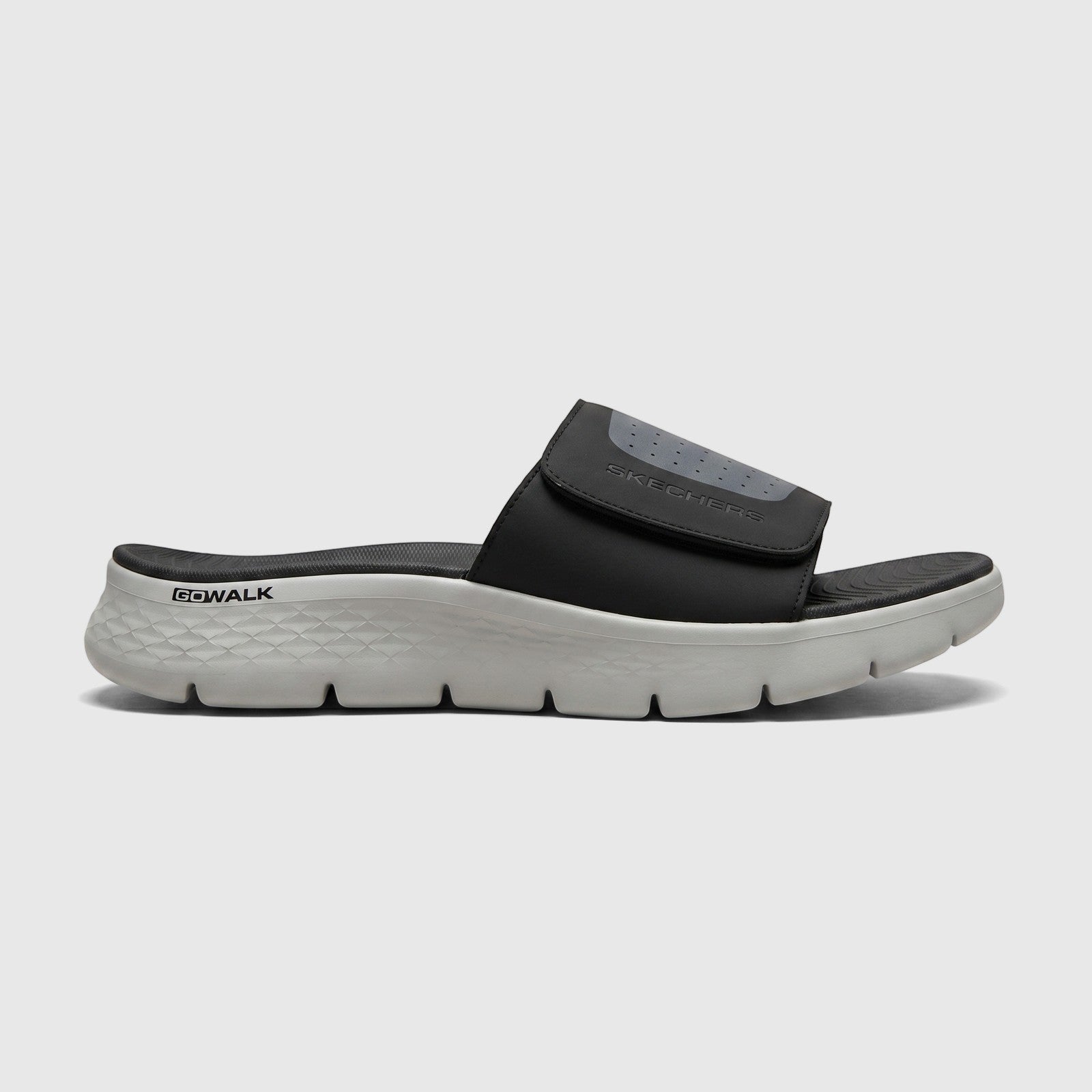 Skechers Men's Comfort Slide Go Walk Flex Sandal 229204 in black and light grey, shown from a side view.