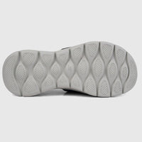 Bottom view of a Skechers Men's Comfort Slide Go Walk Flex Sandal 229204 in black, showcasing its light gray patterned