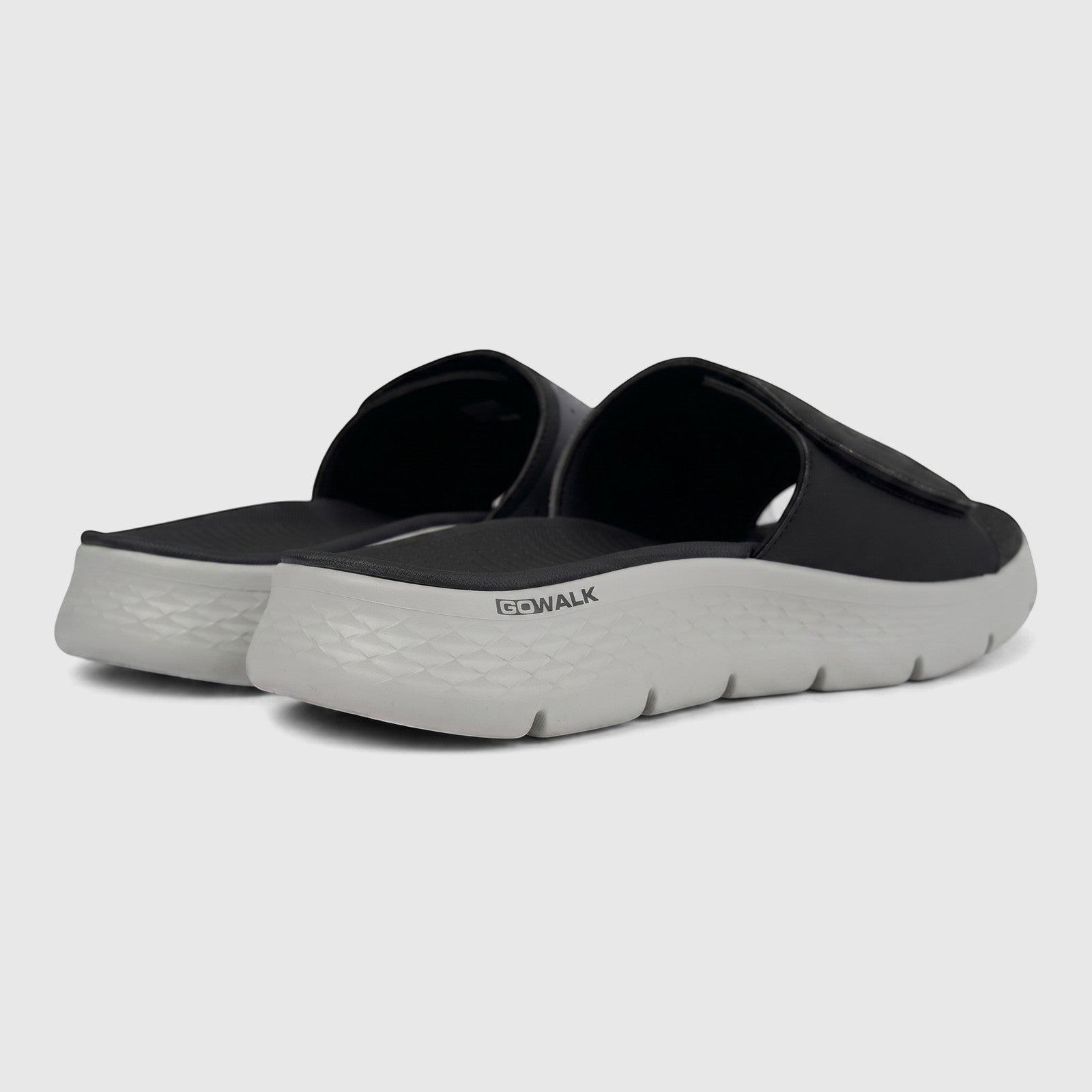 Skechers Men's Comfort Slide Go Walk Flex Sandals 229204 in black and grey, shown in a rear-quarter view.