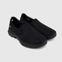 Pair of black Skechers Men's Comfort Slip On Go Walk 7 sneakers with a mesh upper, displayed at an angle.