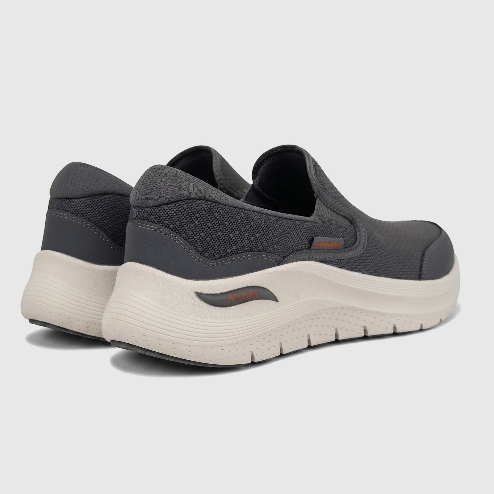 Charcoal grey Skechers Men's Comfort Slip On Sneaker Arch Fit 2.0, with mesh upper and light sole, seen from a rear-side