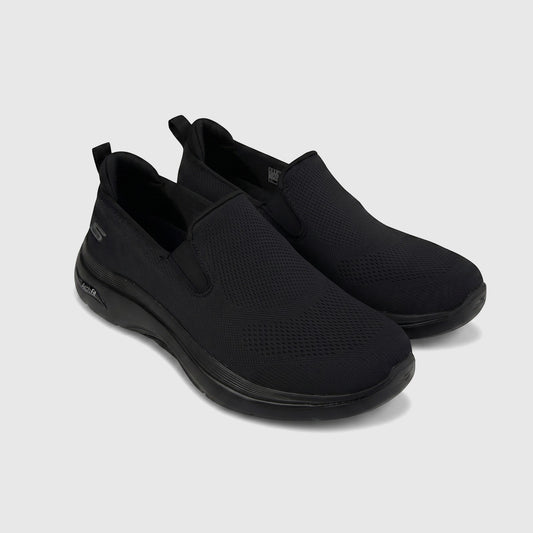 Black Skechers Men's Comfort Slip On Sneaker Go Walk Arch Fit 2.0 with mesh upper, shown in side profile.