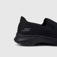 Side view of a black Skechers Men's Comfort Slip On Sneaker Go Walk 7 216646. Features a mesh upper and 'hyper pillars' sole.