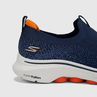 Skechers Men's Comfort Slip On Sneaker Go Walk 7 216633 in navy and orange, shown in a close-up side view.