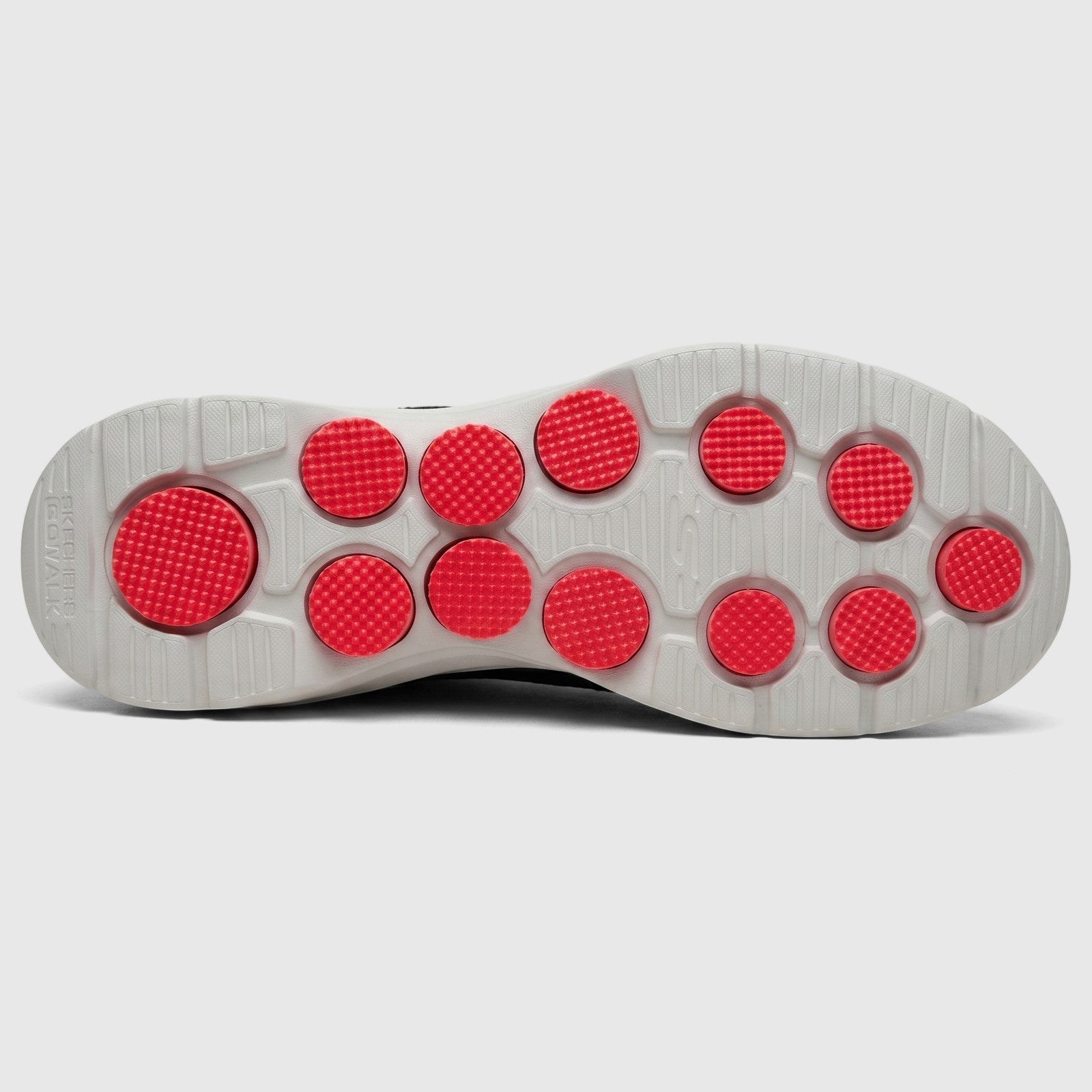 Bottom view of a Skechers Men's Comfort Slip On Sneaker Go Walk 7 in charcoal black, showing the grey sole with round red