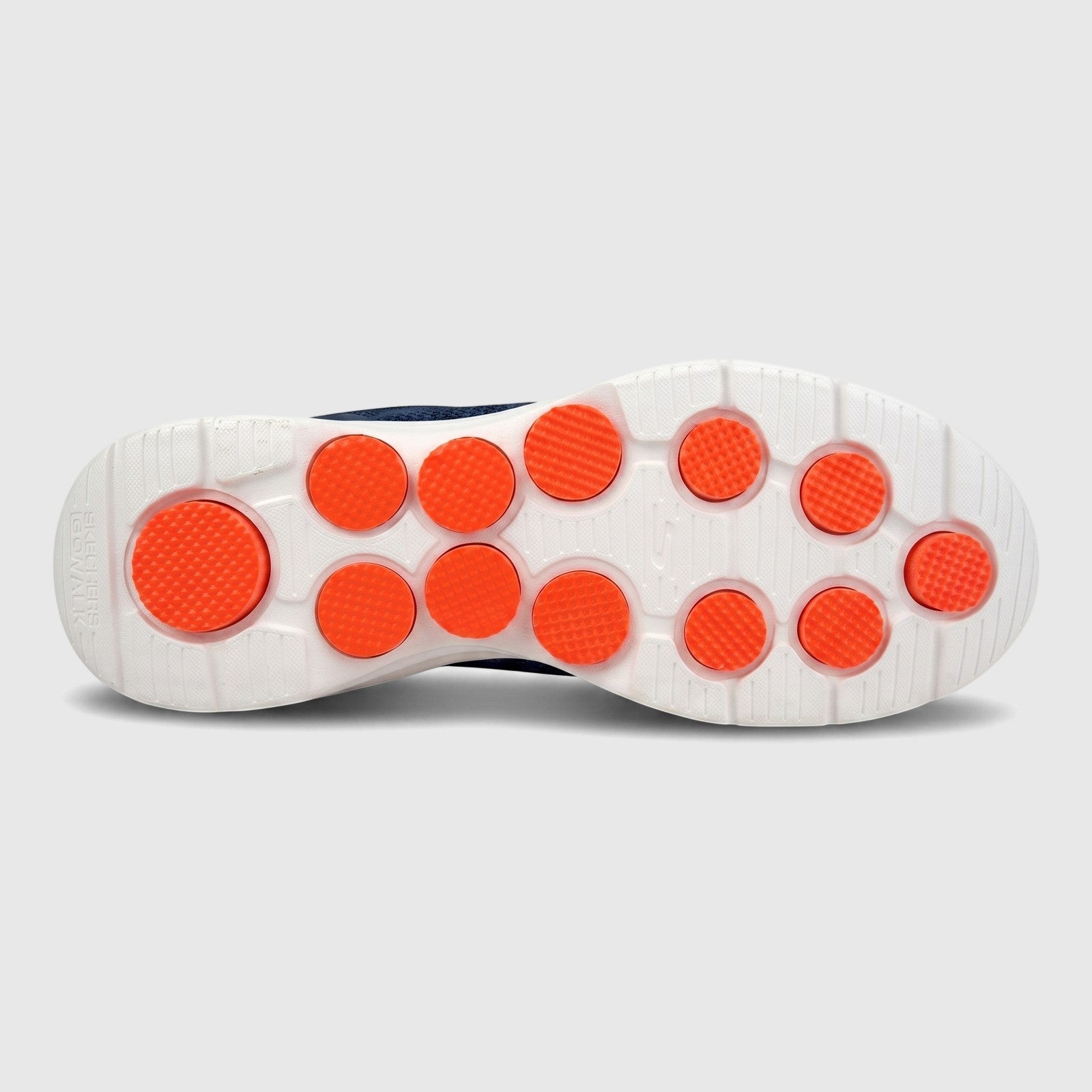 Bottom view of a Skechers Men's Comfort Slip On Sneaker Go Walk 7, featuring a white sole with orange textured pods.