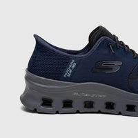 Side view of a Skechers Men's Glide-Step Pro comfort sneaker in navy blue and charcoal gray, showing mesh upper and unique