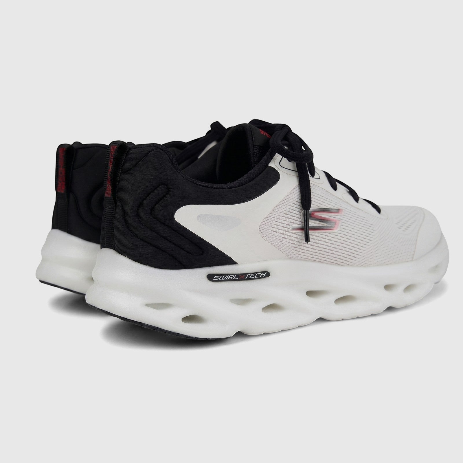 Pair of Skechers Men's Comfort Sneaker Go Run Swirl Tech Speed 220905 in white and black, shown from the side profile.