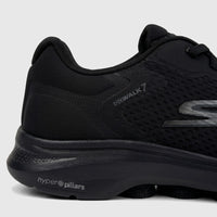 Close-up of a black Skechers Men's Comfort Sneaker Go Walk 7, showcasing the mesh upper, 'GOWALK 7' text, and 'hyper